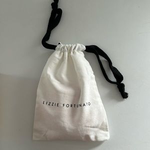 A Lizzie Fortunato arc cuff bracelet in persimmon.